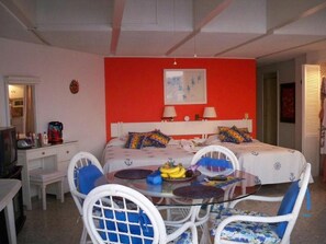 Inside dining area, bed area, make-up vanity and mirror