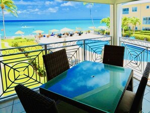 Private Balcony Patio is roofed in and screened in. Overhead fan too!