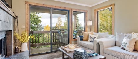 Cozy family room with deck overlooking the lake.  