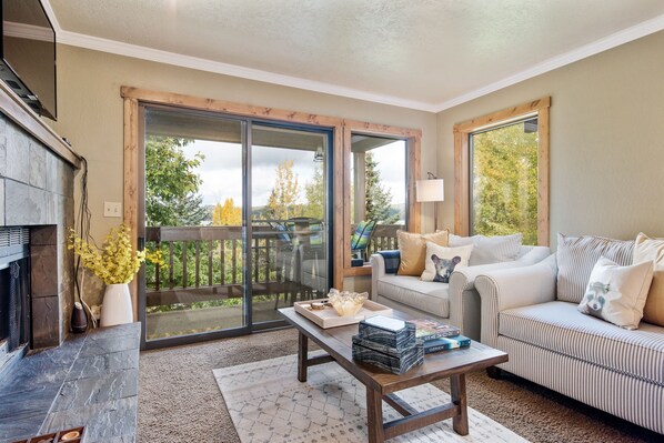 Cozy family room with deck overlooking the lake.  