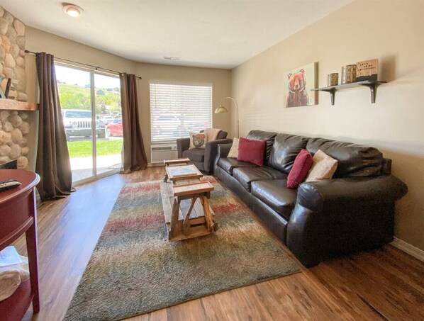 Comfy living space with rustic charm, plush seating, and natural light for ultimate relaxation