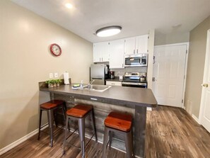 Bright, modern kitchen with cozy bar seating—perfect for morning coffee or evening conversations