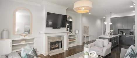 Living Room w/ TV and access to 1st Floor Balcony!