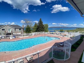 Sparkling pool with scenic lake views—your perfect spot for sun, fun, and relaxation.