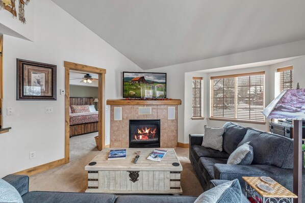 Living Room with 55" TV & gas fireplace & new couch and loveseat