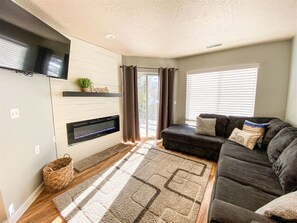TV, Fireplace and walk out patio