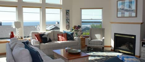 Cozy front room with fireplace and widescreen TV