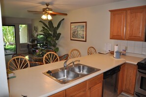 View looking across the counter/bar to living room