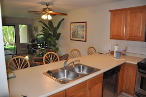 View looking across the counter/bar to living room