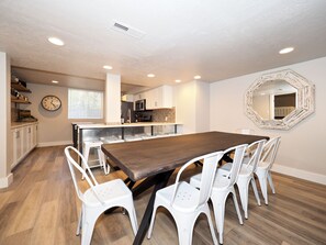 Large Dining Room table with six chairs and a large bench for plenty of seating