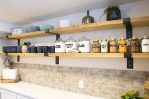 All new dishes, spices, pantry items, completely stocked kitchen.