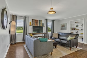 The living room - great natural light, and television.  (SmartTV in Jan 2025)
