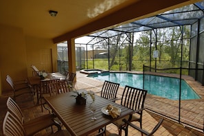 Screened in south facing pool and hot tub, facing greenbelt. So peaceful! 