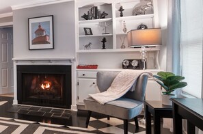 Cozy up to the fire! A lovely spot for reading and relaxing.