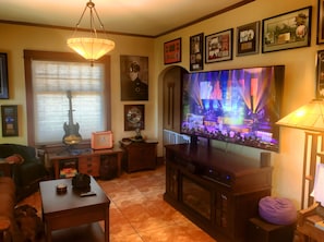 Living room 70” UHD TV with big cable package!