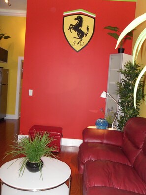 LIVING ROOM, SLEEPER SOFA,  75"  SMART  TV, SITTING CHAIR, LAMINATE FLOORS 