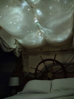 Switch on the tiny lights above the Captain's bed for a beautiful ambiance.