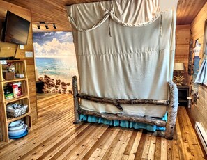 Canopy completely surrounds the bed.Simply loosen the ties & it falls into place