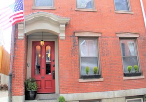 Located in a historic, 1860 brick rowhouse
