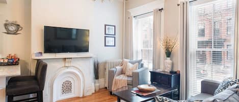 Living room with high ceilings, smart TV and remote controlled lights