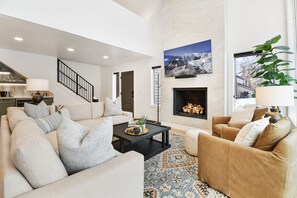 Living Room 65" Smart HDTV, Sonos Sound Bar and Remote-Controlled Gas Fireplace