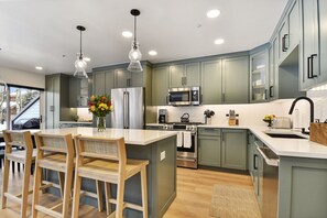 Main Level Kitchen with Professional Appliance including Gas Range Coffee Maker