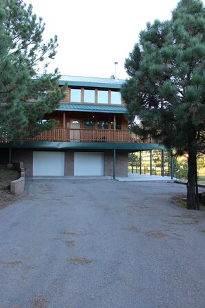 Side of cabin, 2 car garage, wrap around upper deck