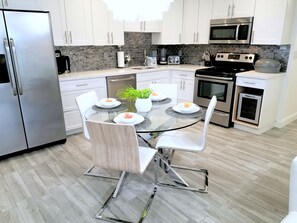 Fully Equipped Open Concept Kitchen & Dining Area