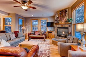 Cozy living room space with warm fireplace.