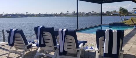 Relax and Enjoy on 60 ft Long Pool Deck with unobstructed waterfront viewing.