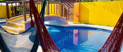 Lounging poolside hammocks. Perfect for hanging out, relaxing or a good book.