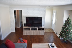 Upstairs Living Room: 60'' TV with cable.
