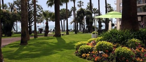 Stroll thru Grand Hotel Garden while walking to the Beach 1 min from Apartment 