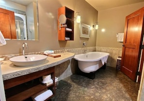 Master bath includes separate soaker tub and rain showerhead