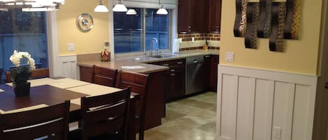 Kitchen and Dining Room overlooking outside Private Patio