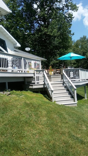lower deck with patio bar and  umbrella.