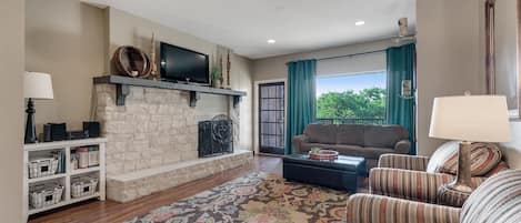 spacious living area with picture window view of the river