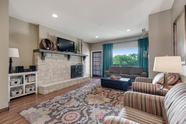 spacious living area with picture window view of the river