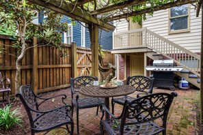Private outdoor pergola with outdoor seating and propane grill for your use