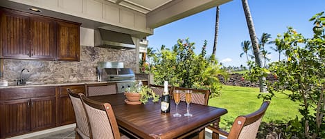 Large lanai with built in BBQ kitchenette outside private dining in paradise