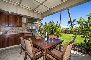 Large lanai with built in BBQ kitchenette outside private dining in paradise