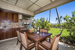 Large lanai with built in BBQ kitchenette outside private dining in paradise