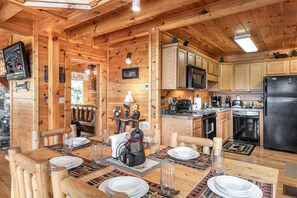 Fully equipped kitchen and a dining room that seats six.