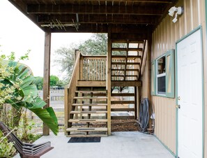 Door to right is the private laundry room. Stairs lead to your vacation home!