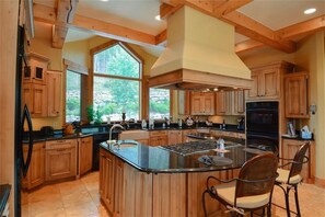 Fully equipped kitchen with two dishwashers, two ovens, and three sinks