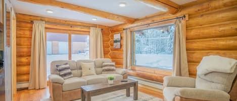 Open Floor Plan Living Room with Relaxing Cabin Vibes and Comfy Couch