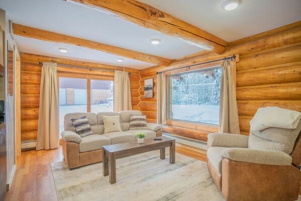 Open Floor Plan Living Room with Relaxing Cabin Vibes and Comfy Couch