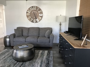 Family room with new furniture, Apple TV