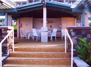 COVERED BAR-B-QUE AREA WITH DINING AREA AND 4 GAS GRILLS