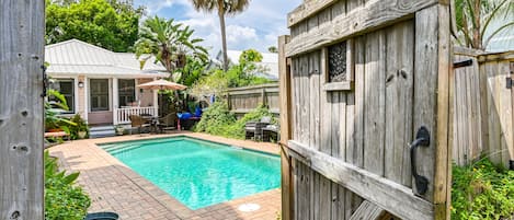 The circa 1875 Cottage overlooks the private heated pool. 